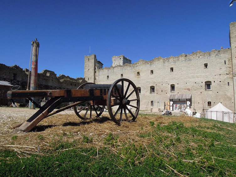 Exterior of the Rakvere Castle in Estonia with a cannon in the foreground