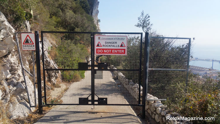 Danger Rockfalls road sign displayed on a fence in Gibraltar