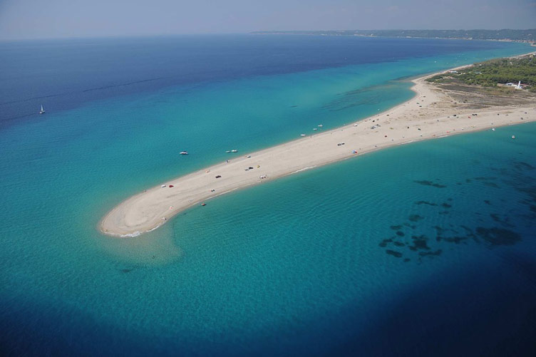 Photographed from the bird eye view is an extention of white sand beach into blue waters