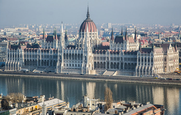 Hungarian parliament building and the city in a distance on the other side of river Danube