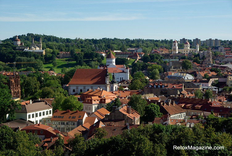 Vilnius city, the capital of Lithuania. Visible in the photograph are churches, a cathedral, rooftops of the old town and treetops