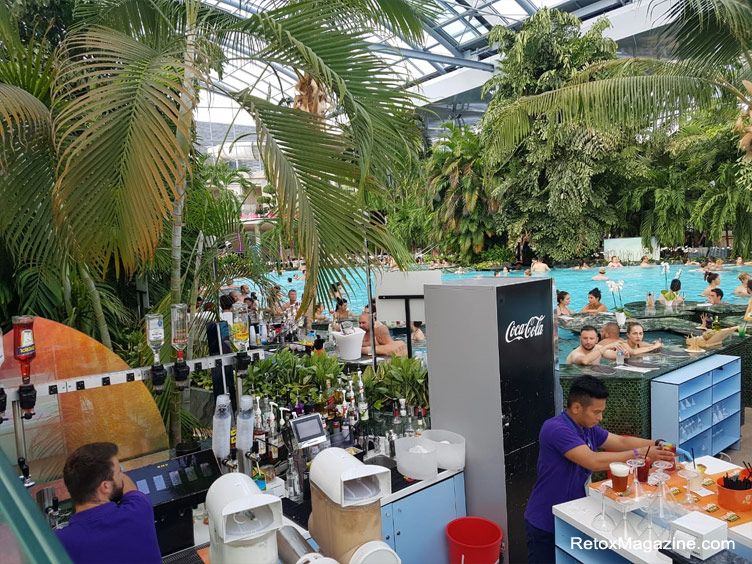 Bar tenders making drinks at the indoor pool bar for punters at Therme Bucuresti