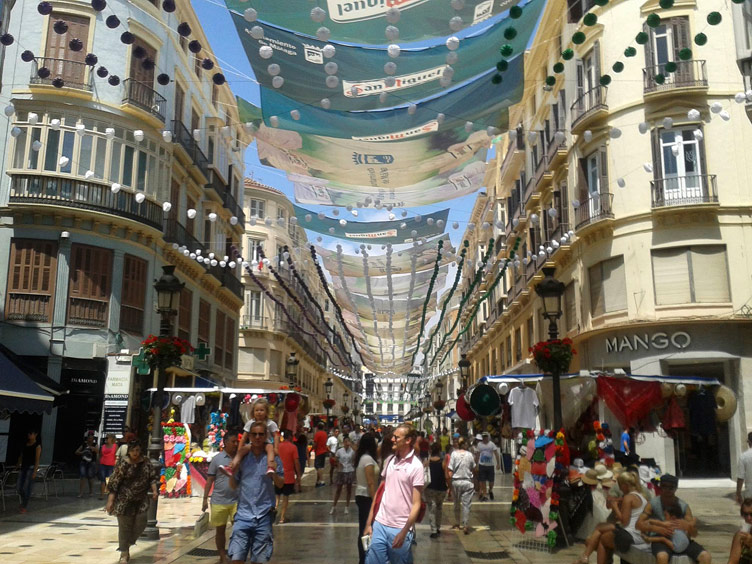 The bustling and decorated Calle Lar-ios in Malaga during the Summer Fair