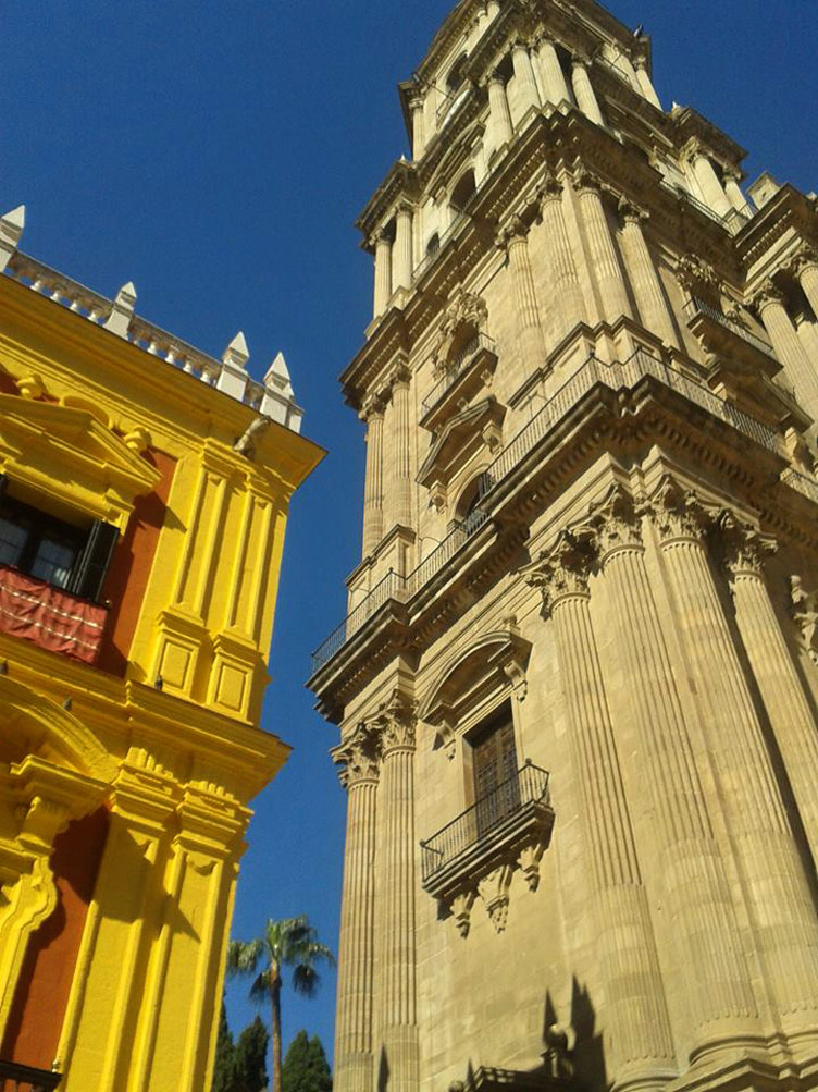 Stunning majestic buildings featuring old architectural style in the historic Malaga city centre