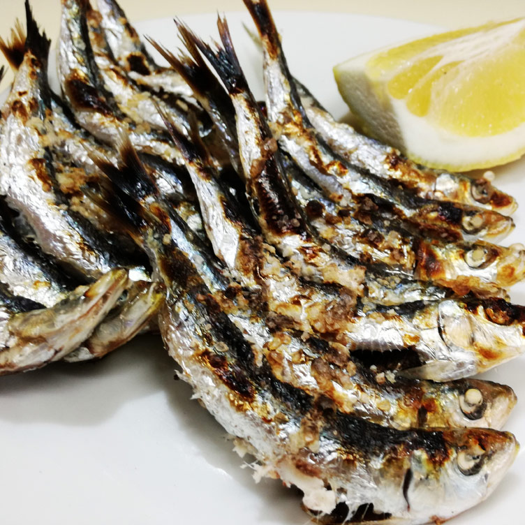 Close up photograph of Espetos Sardines, local Malaga food in El Palo