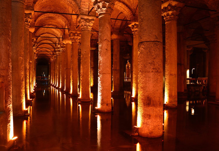 The arches of the underground Basilica Cistern in Istanbul, beautifully lit for visitors to see